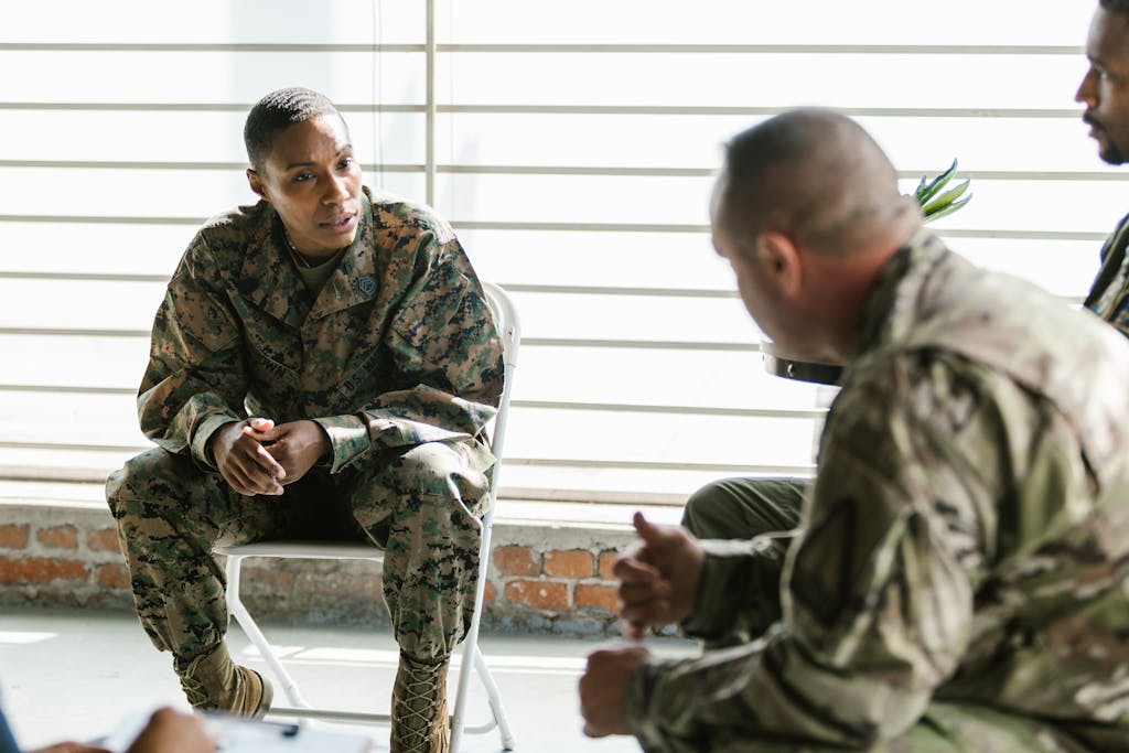 Photo of Soldier Actively Listening to her Comrade